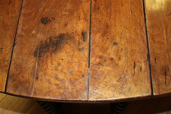 An 18th century walnut oval gateleg dining table, extended 4ft 9in.